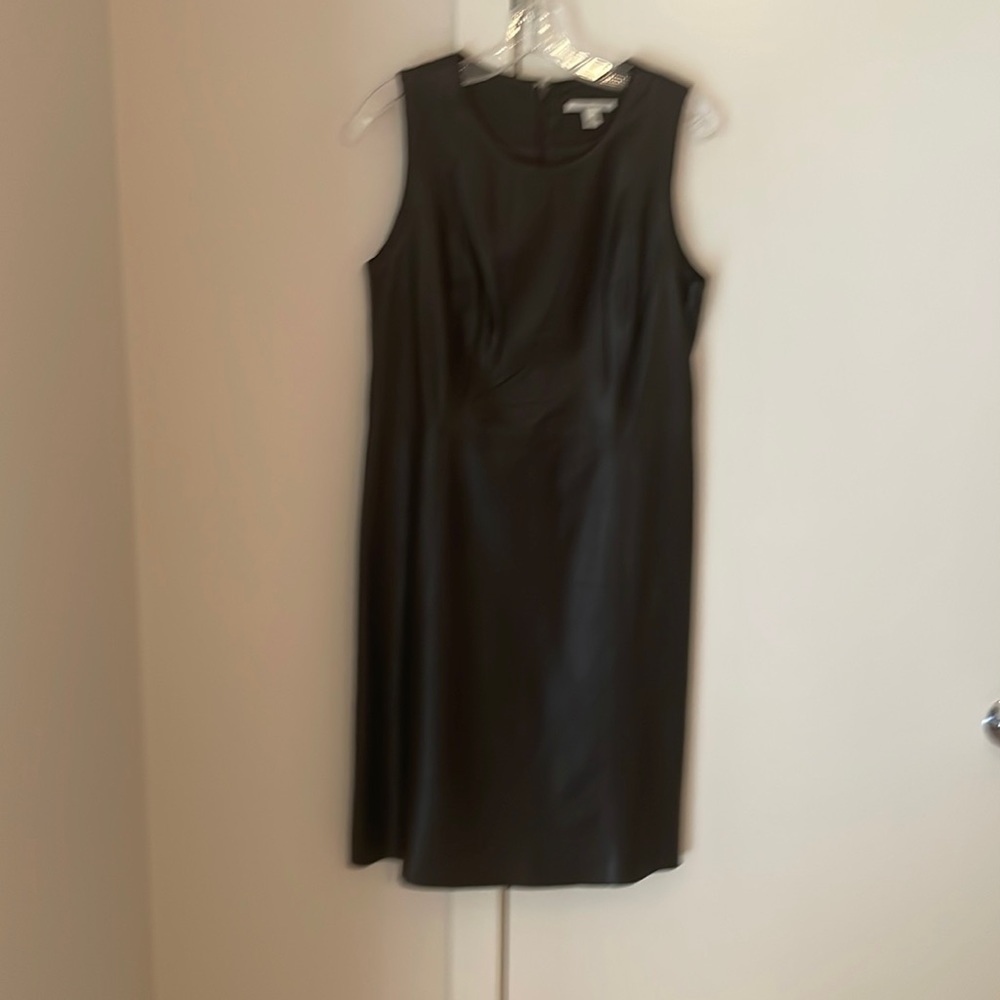 Very Dark Brown 100% Leather dress. Short sleeve with nice pleats.